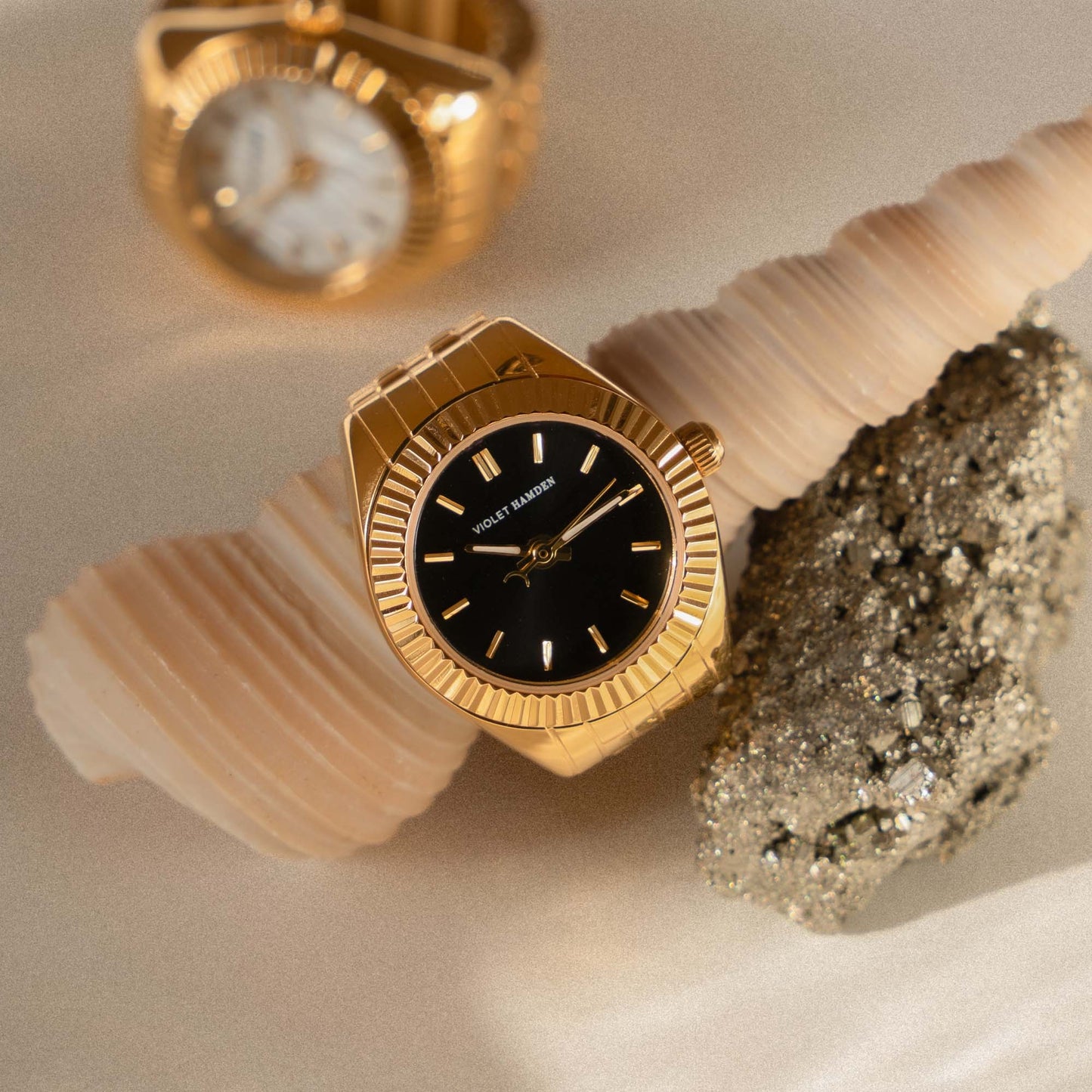 Sunrise gold coloured watch ring