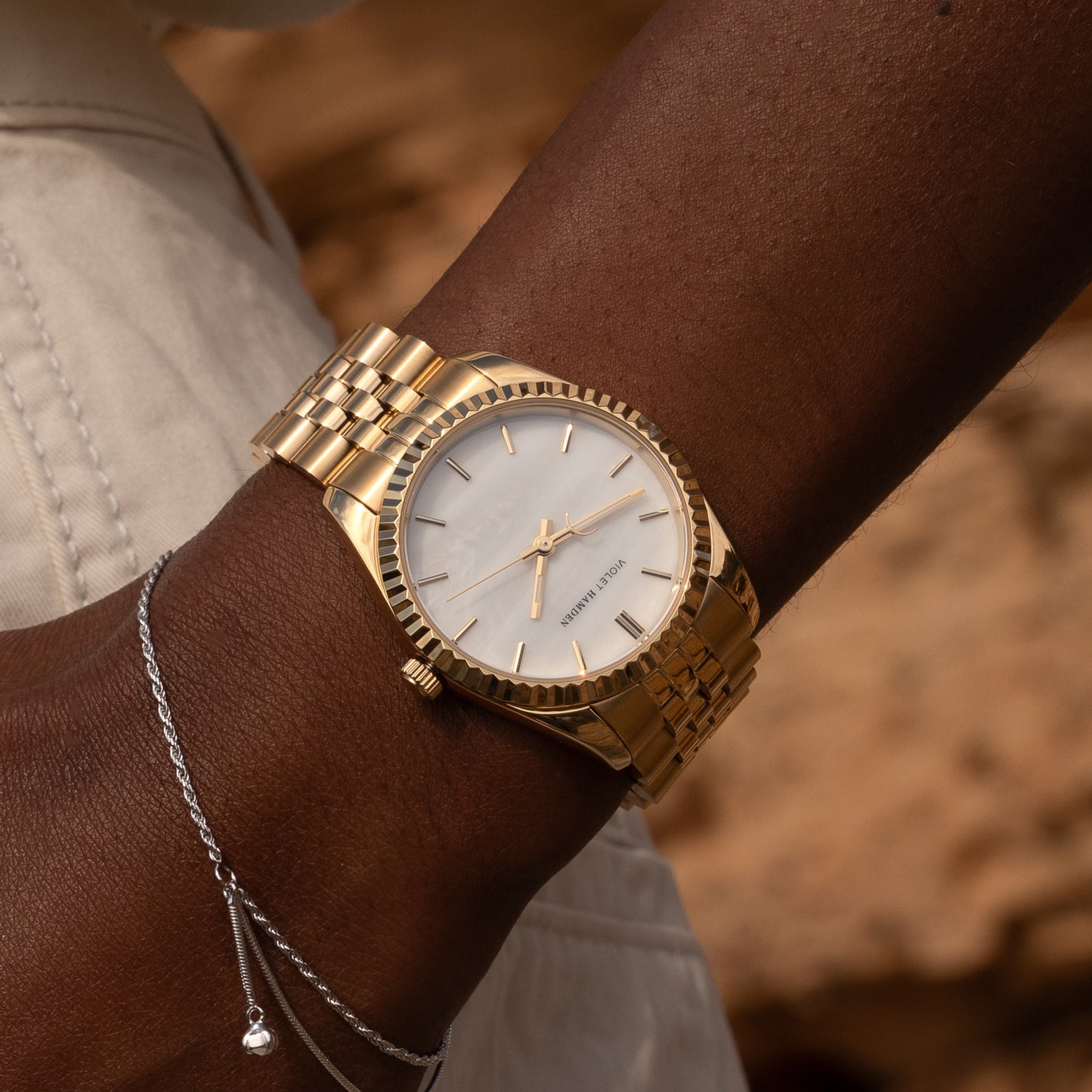 Sunrise round ladies watch gold coloured and mother of pearl